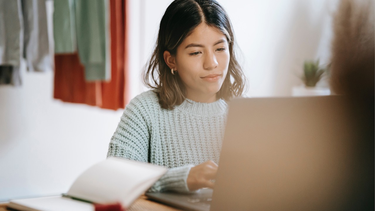 girl taking test on laptop