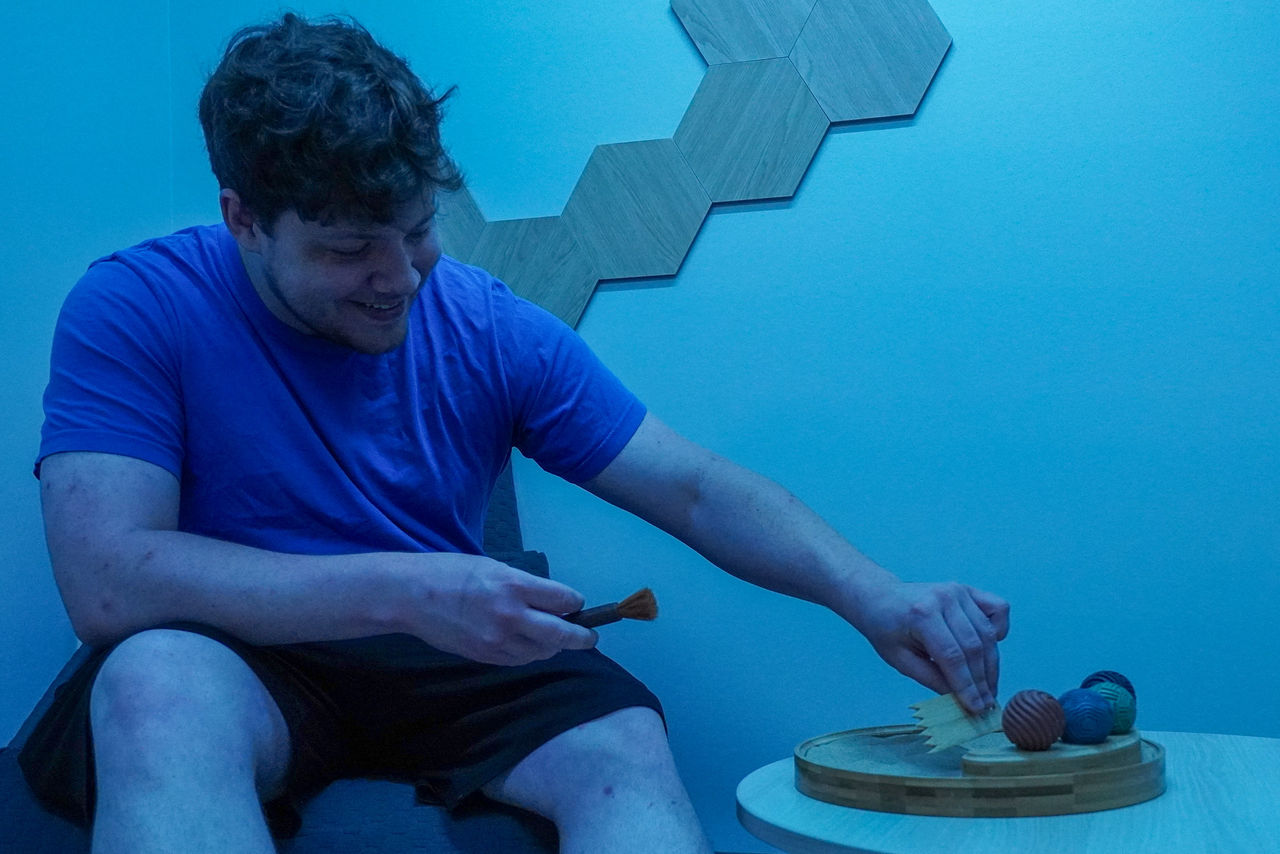 student uses zen garden in the meditation room